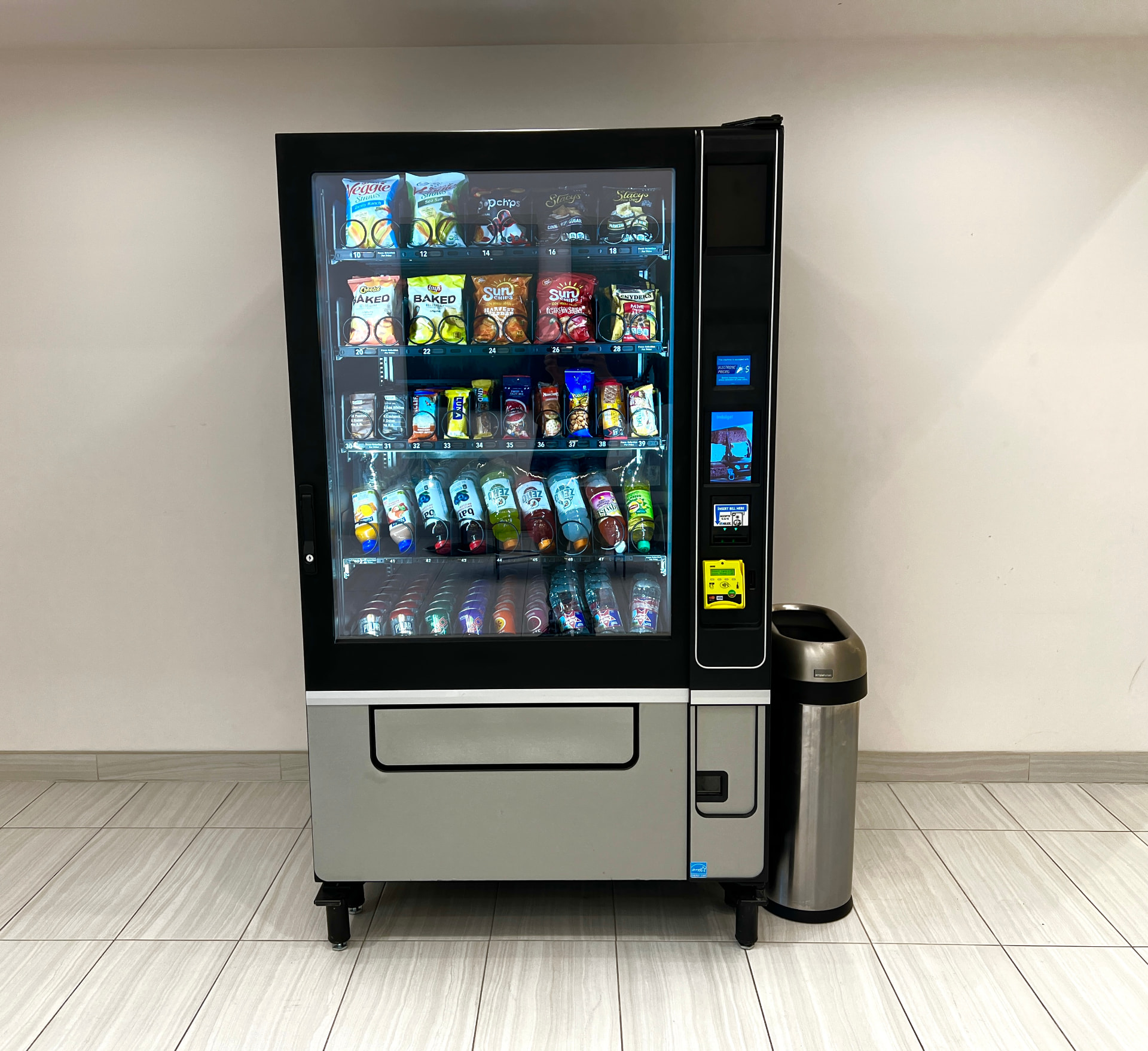 Combo snack and drink vending machine in a modern office lobby